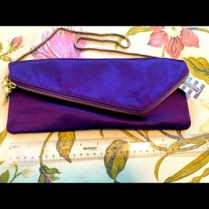 NWT PURPLE AND GOLD HENRI BENDEL CLUTCH!